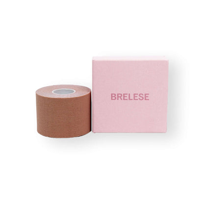 Chocolate 5cm boob tape placed next to the pink box with the Brelese logo.
