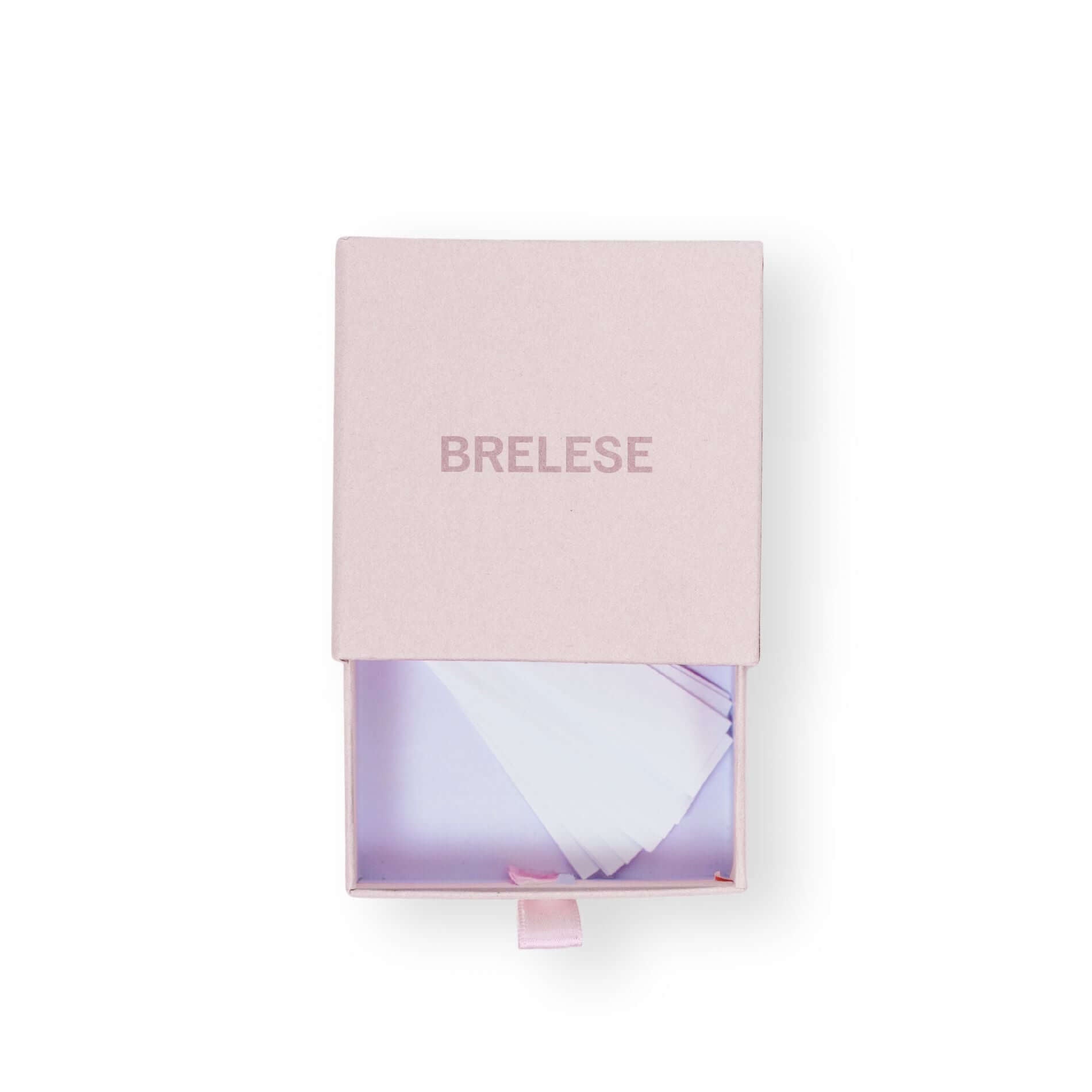Clothing and fashion tape packaged in a pink box featuring the Brelese logo.