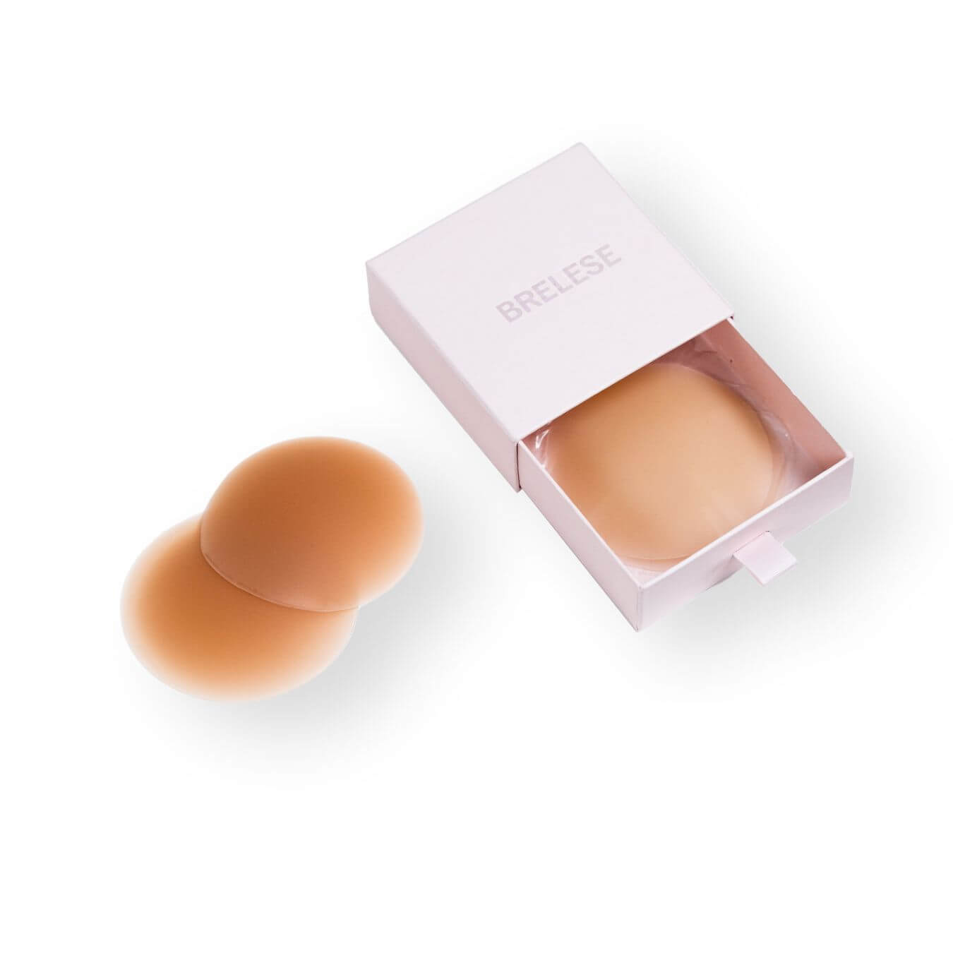 Brelese box with beige nipple covers inside and chocolate nipple covers on the side of the box.